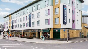 A multi-story Travelodge hotel with a modern design, featuring a mix of brick and panel exteriors. - Travelodge Farnborough Central (Farnborough)