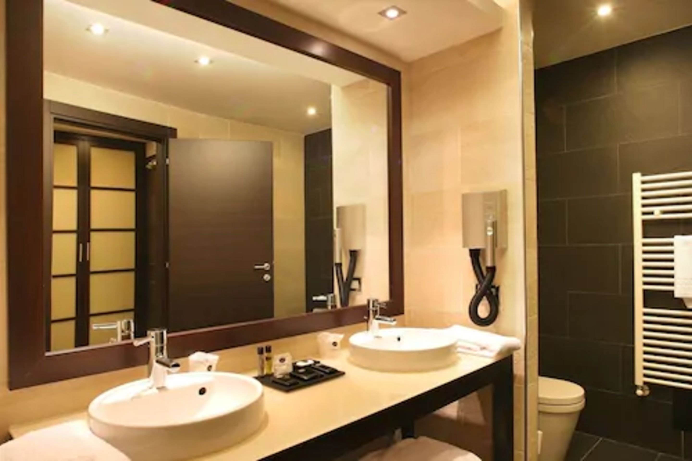 hair dryer, slippers, bidet, towels