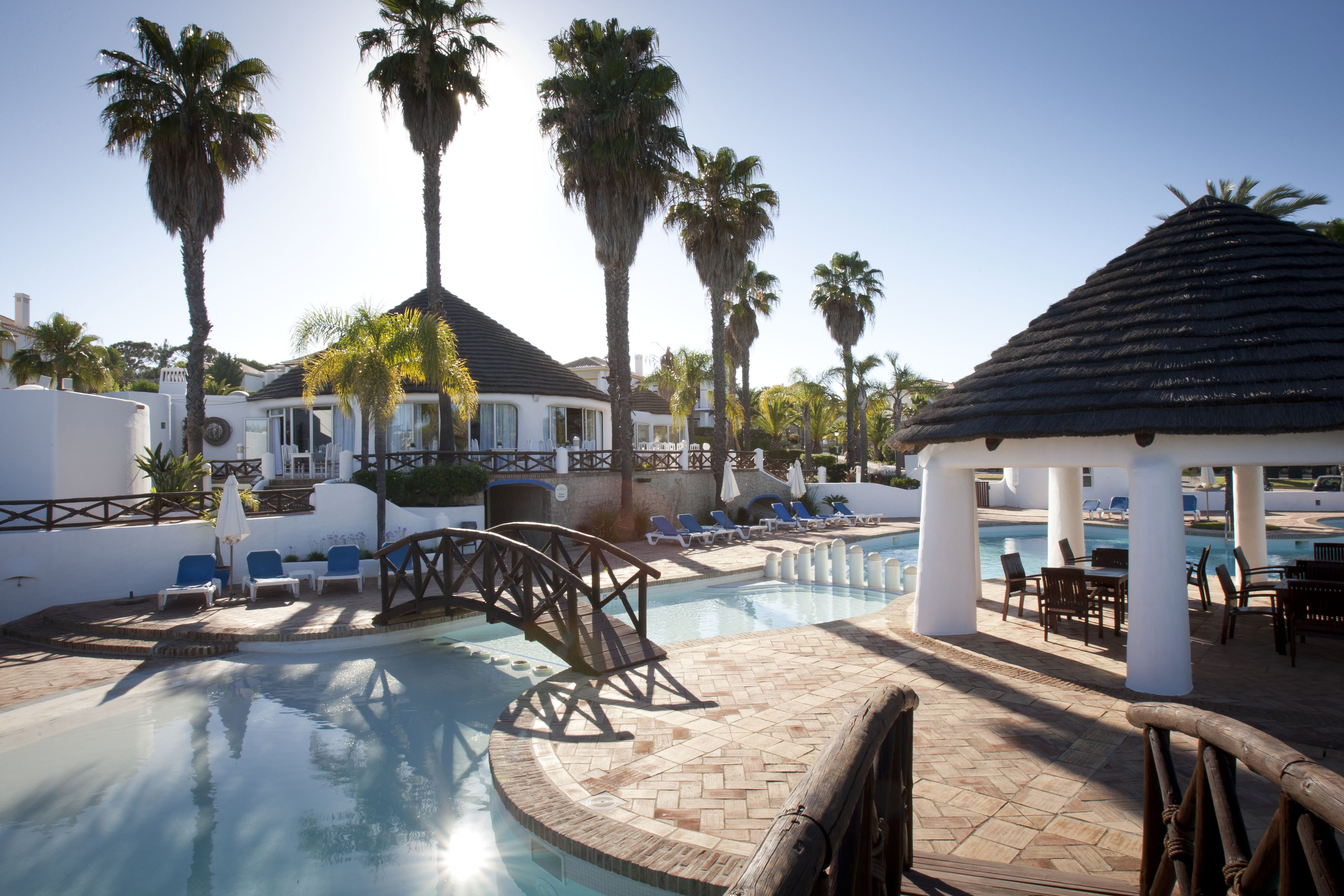 outdoor pool, open 10:00 am to 7:00 pm, pool umbrellas, pool loungers