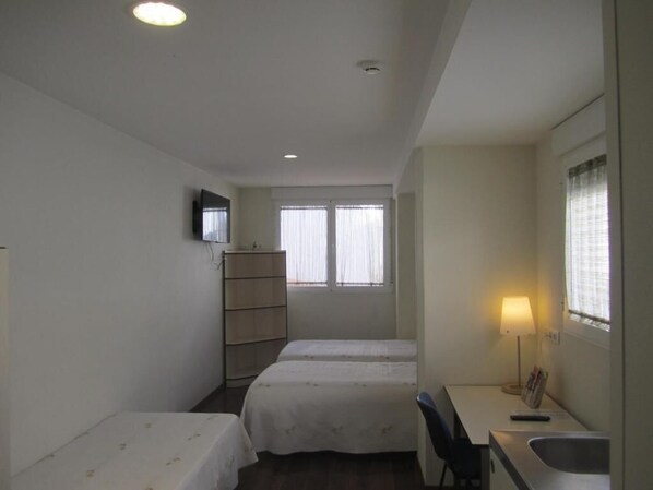 Down duvets, desk, iron/ironing board, cots/infant beds