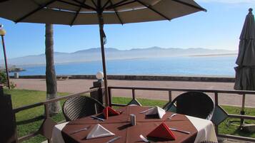 Breakfast, lunch, dinner served; beach views