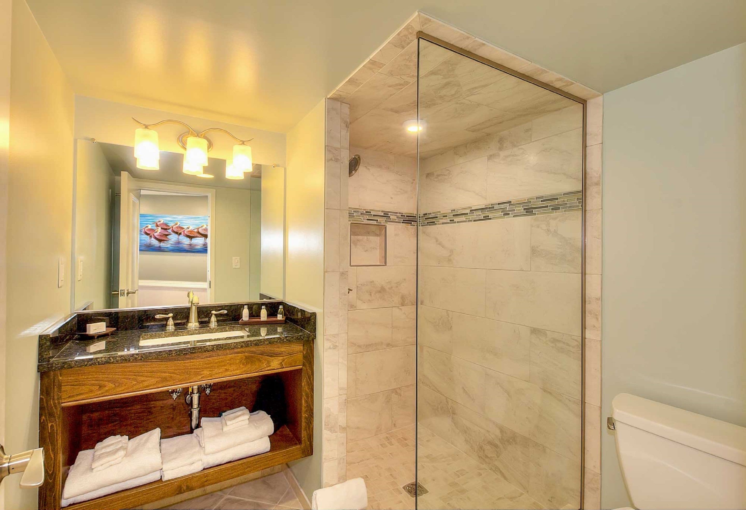 designer toiletries, hair dryer, towels, soap