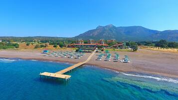 Private beach, free beach cabanas, beach shuttle, sun-loungers