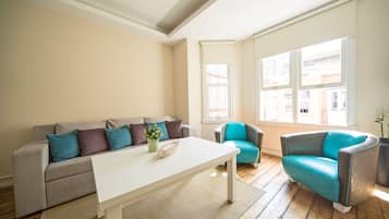 Family Apartment, 1 Bedroom | Living room | 80-cm LCD TV with satellite channels, TV, DVD player