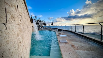 Seasonal outdoor pool, open 8 AM to 6:30 PM, pool umbrellas