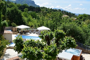 Seasonal outdoor pool, open 10:00 AM to 7:00 PM, pool umbrellas