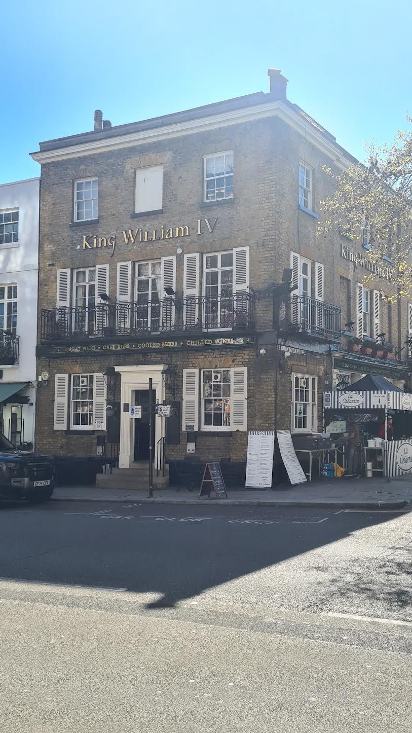 A two-story building with the name 'King William IV' on the facade.