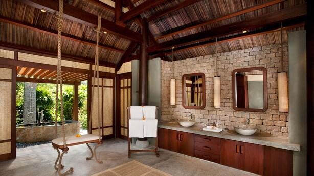 A spacious bathroom with a large sink, two mirrors, and a hanging towel rack. - L'Alya Ninh Van Bay (Dong Ninh Hoa)