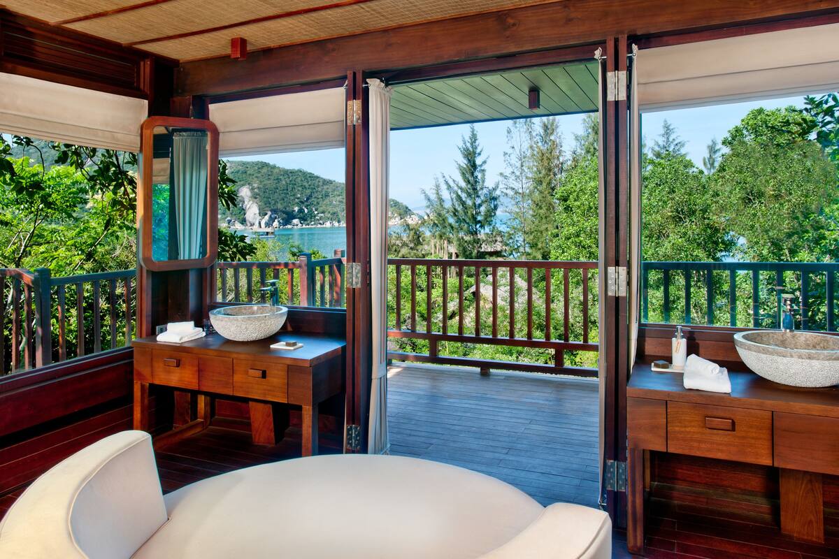 hill rock pool villa | bathroom | separate bathtub and shower, rainfall showerhead, designer toiletries