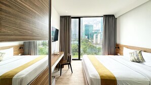 Deluxe Room | Premium bedding, pillow-top beds, minibar, in-room safe - Rasuna Icon Hotel (Jakarta)