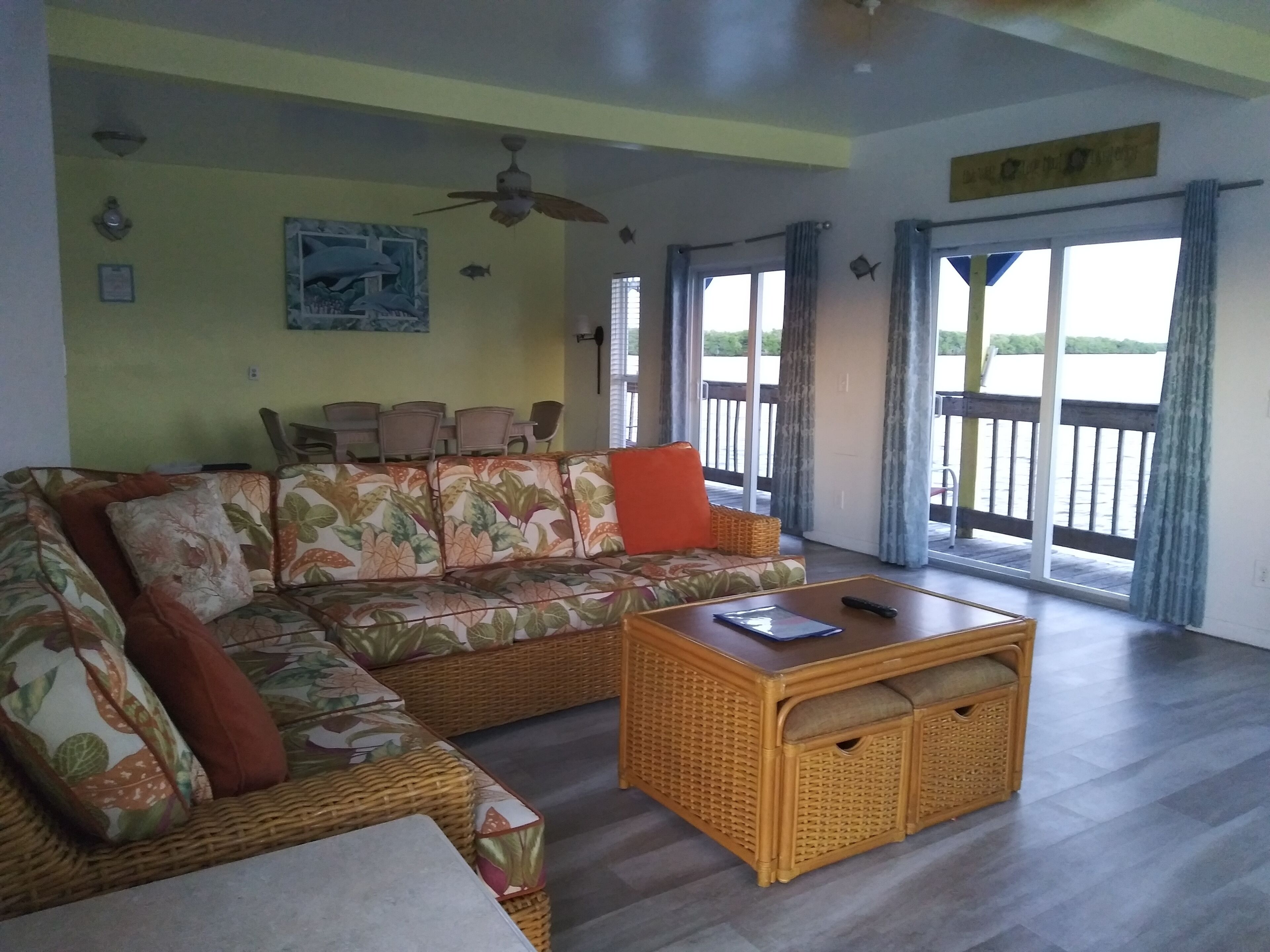 Corner Waterview Suite With Semi Private Deck | Living area | 42-inch flat-screen TV with cable channels, TV