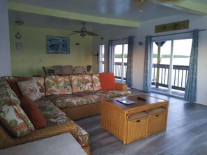 Corner Waterview Suite With Semi Private Deck | Living area | 42-inch flat-screen TV with cable channels, TV - Bridgewater Inn (Matlacha)