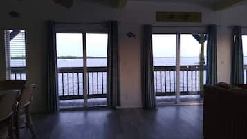 Corner Waterview Suite With Semi Private Deck | Living area | 42-inch flat-screen TV with cable channels, TV