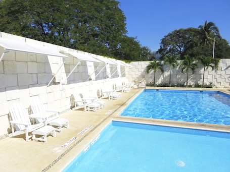 Outdoor pool, open 7:00 AM to 7:00 PM, sun loungers