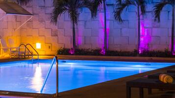 Outdoor pool, open 7:00 AM to 7:00 PM, pool loungers