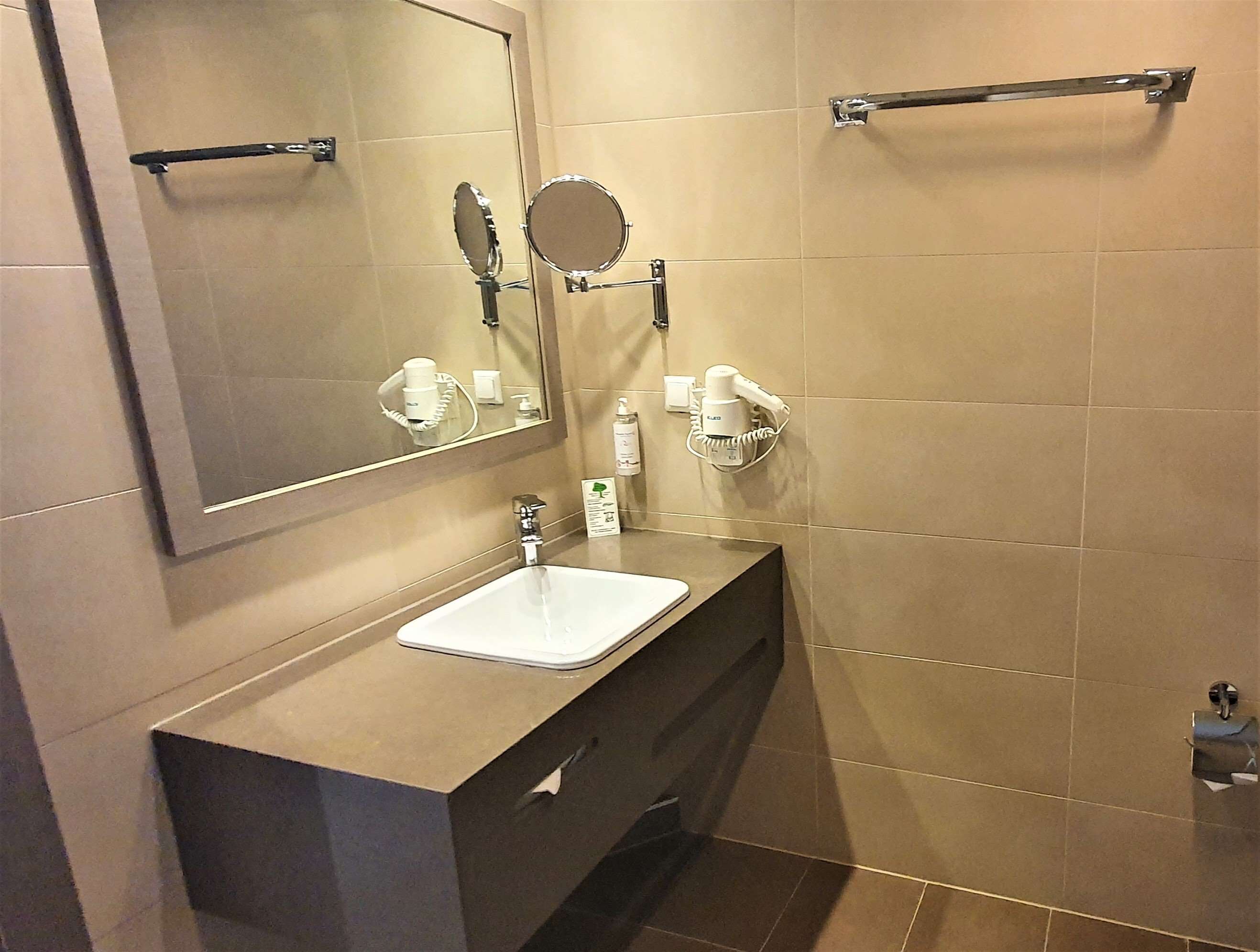 suite, 1 king bed | bathroom | rainfall showerhead, eco-friendly toiletries, hair dryer, towels