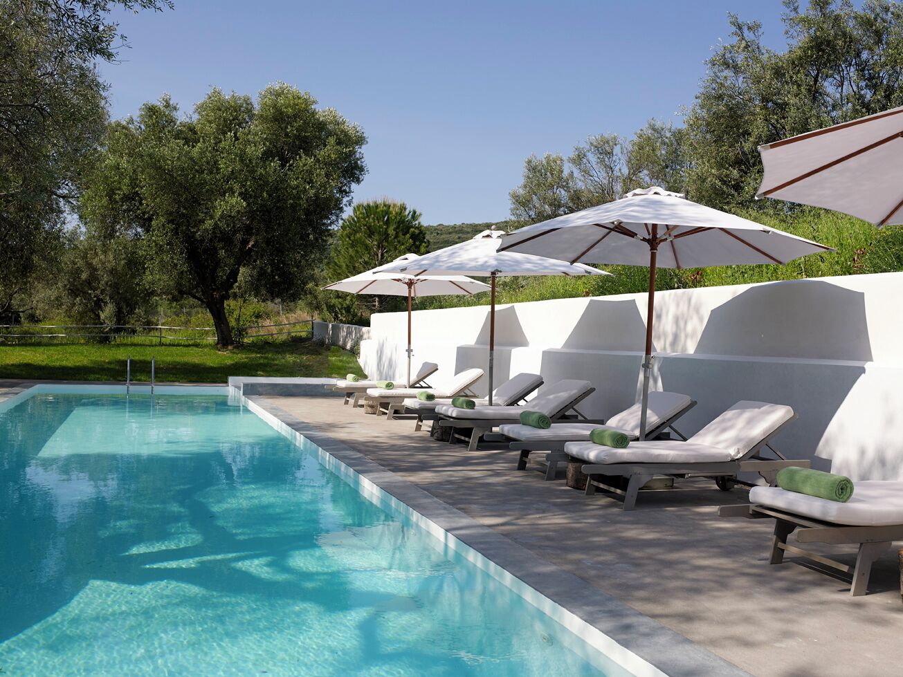 outdoor pool, pool umbrellas, pool loungers