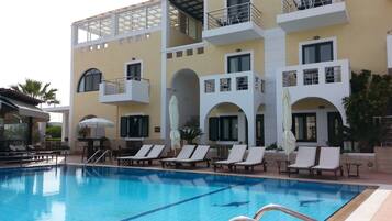 Seasonal outdoor pool, pool umbrellas, pool loungers