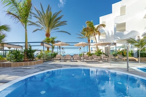 Outdoor pool, pool umbrellas, pool loungers