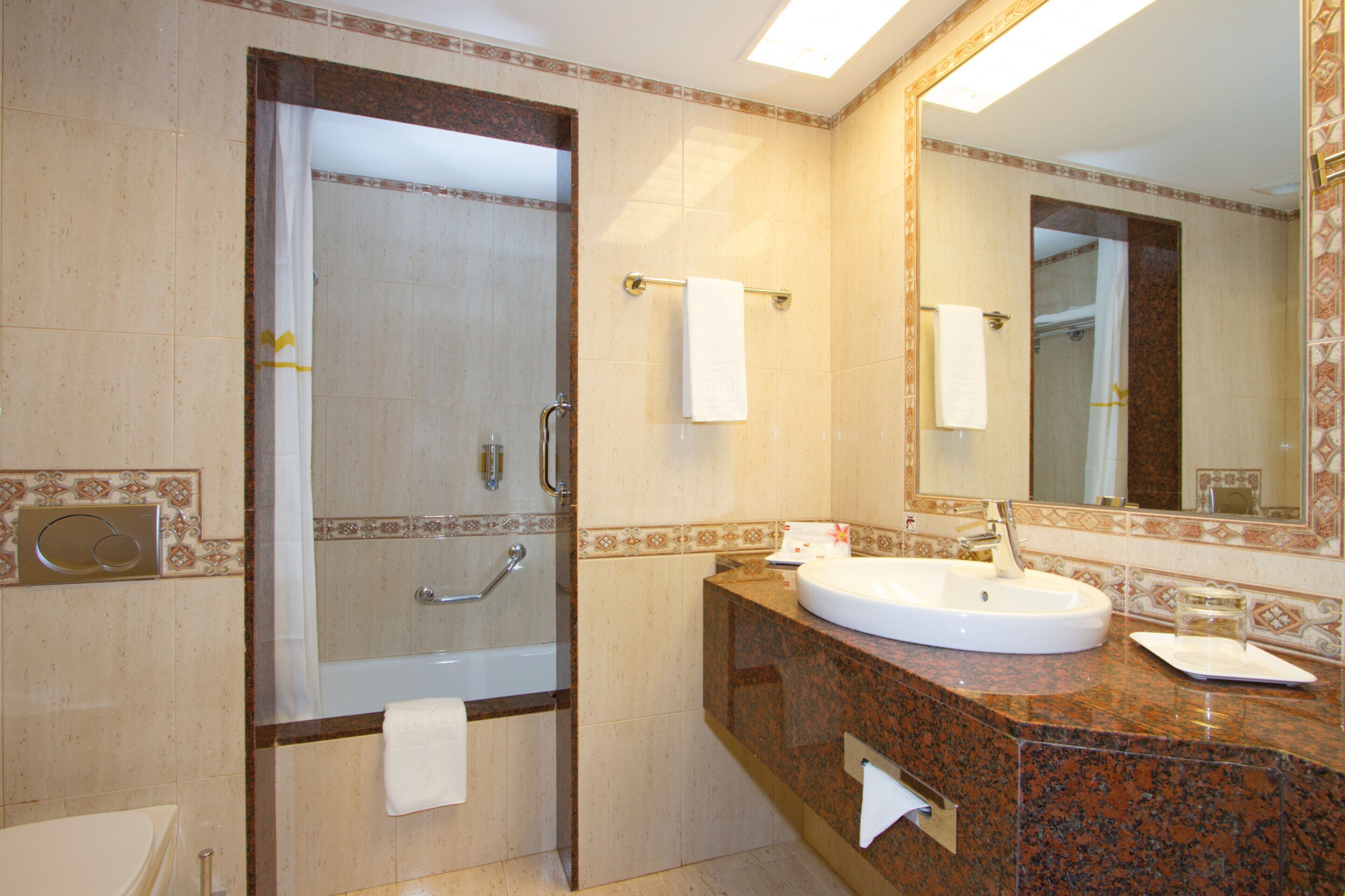 bathtub, eco-friendly toiletries, hair dryer, bathrobes