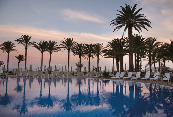 2 outdoor pools, pool umbrellas, sun loungers