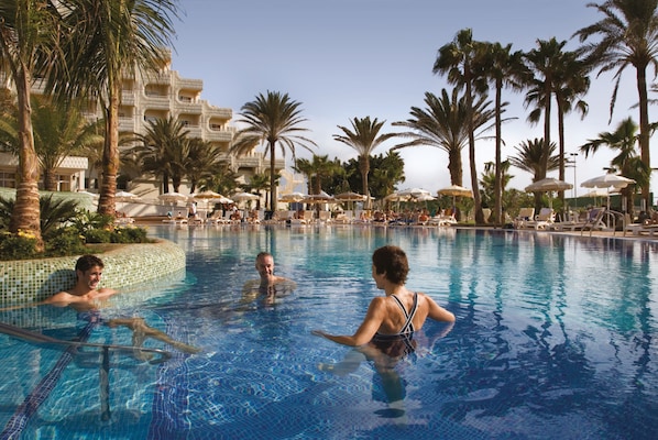 2 outdoor pools, pool umbrellas, pool loungers