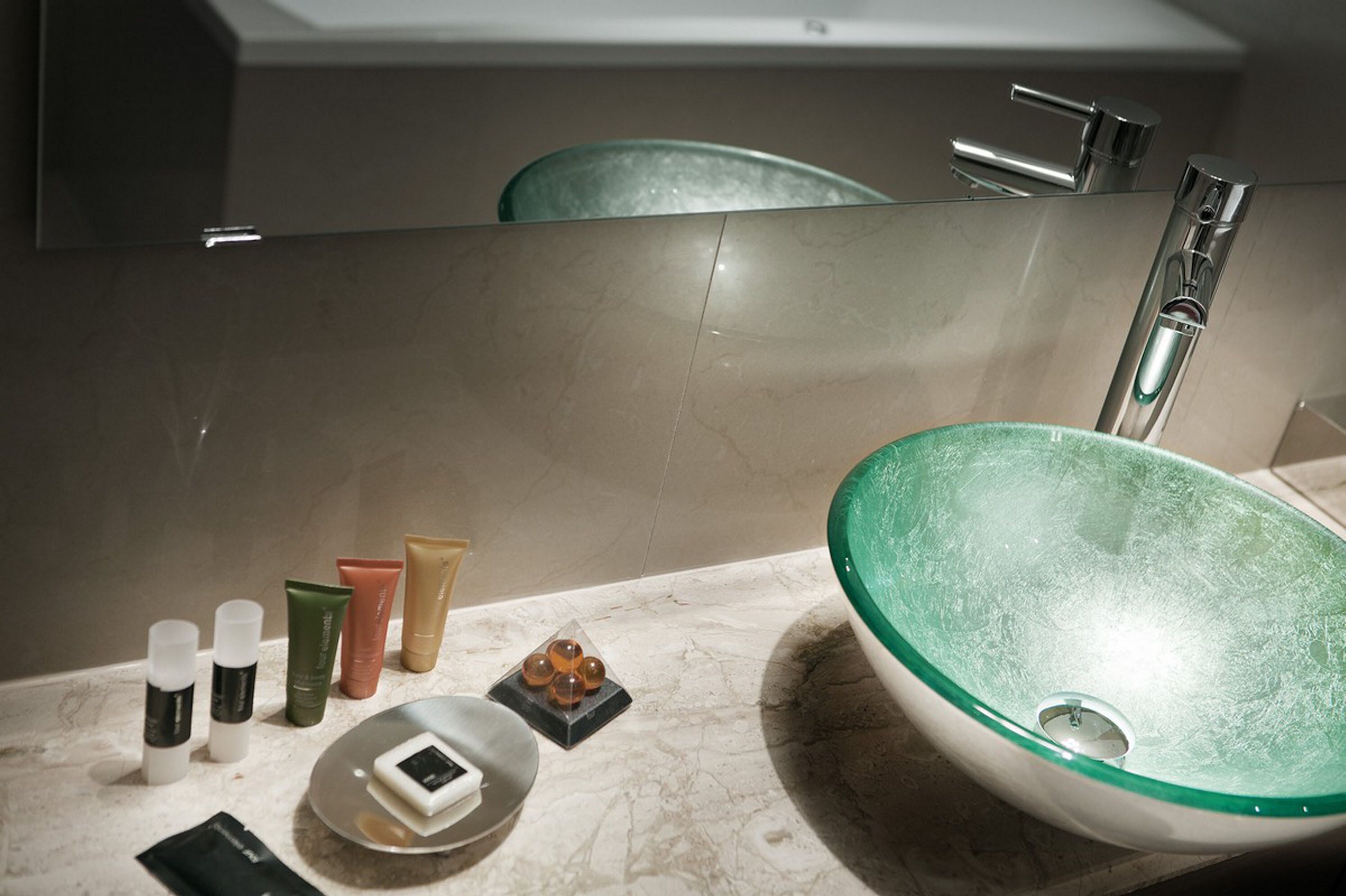 designer toiletries, hair dryer, towels