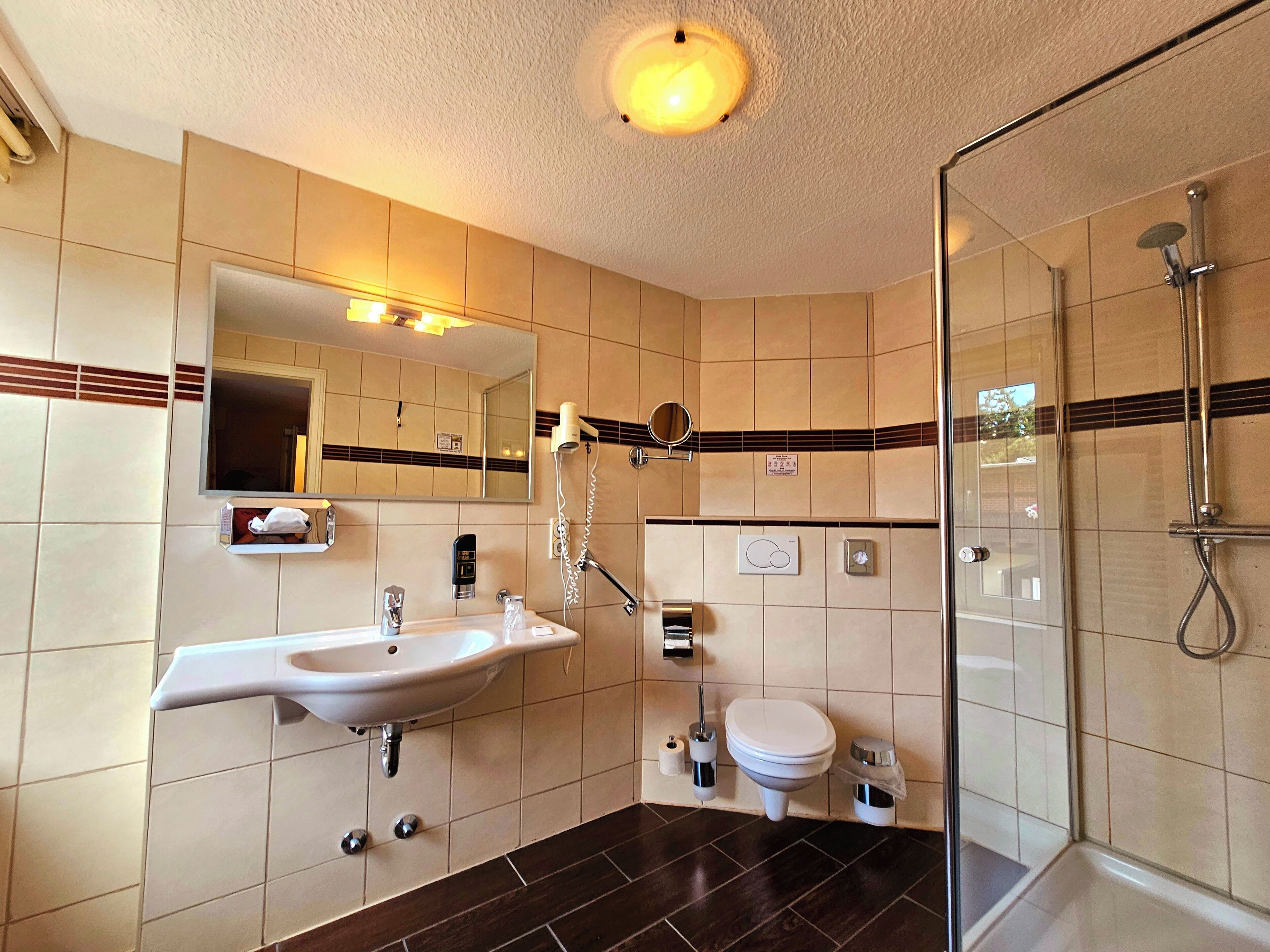 basic single room | bathroom | shower, free toiletries, hair dryer, towels