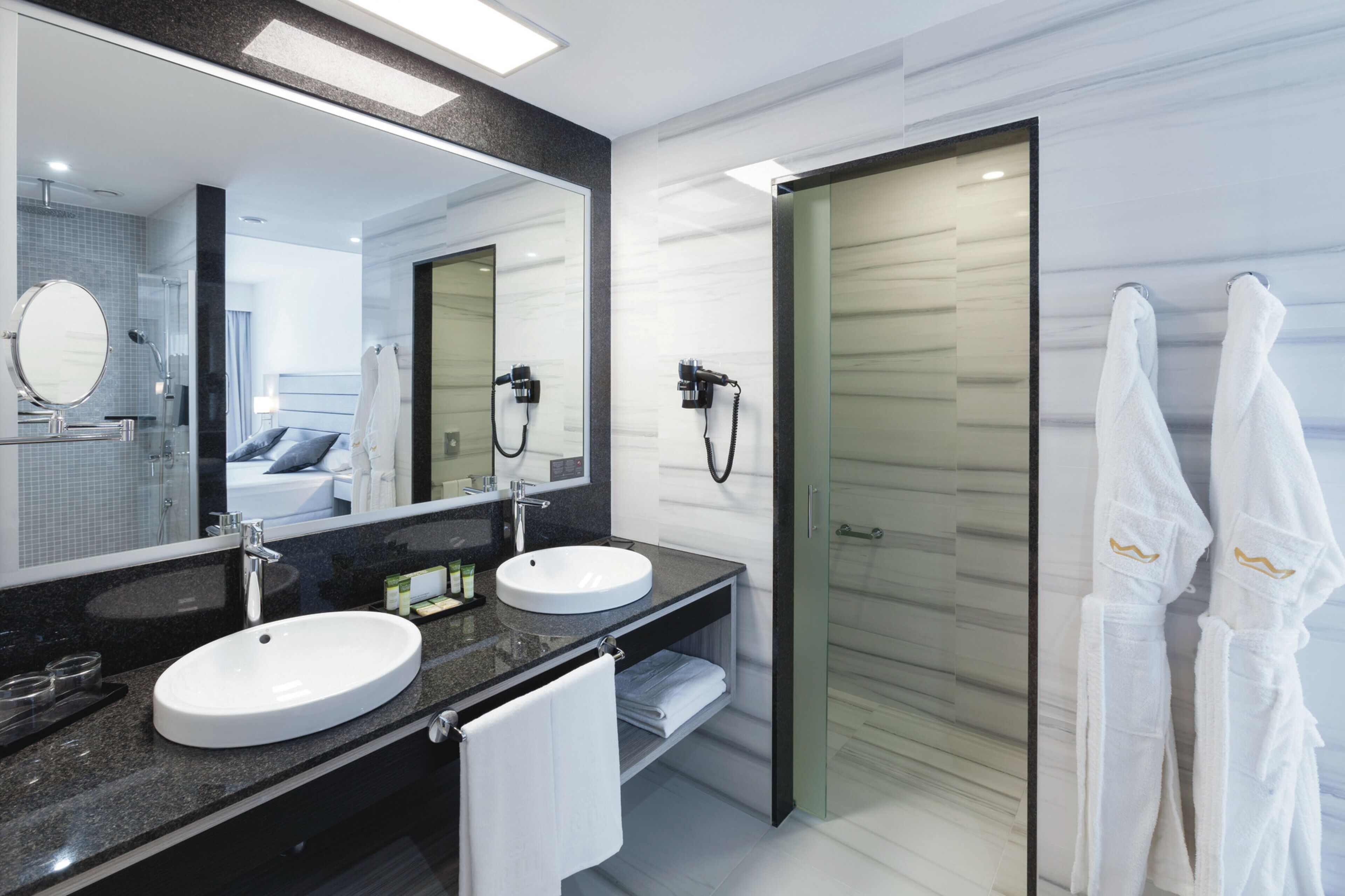 junior suite, balcony, sea view (adults only) | bathroom | shower, eco-friendly toiletries, hair dryer, bathrobes