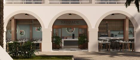 A hotel with a central atrium, multiple dining areas, and a reception desk.