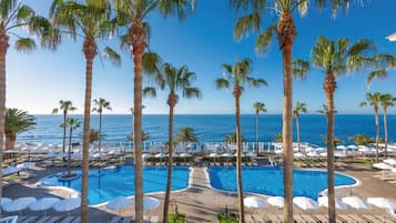 Indoor pool, pool umbrellas, pool loungers