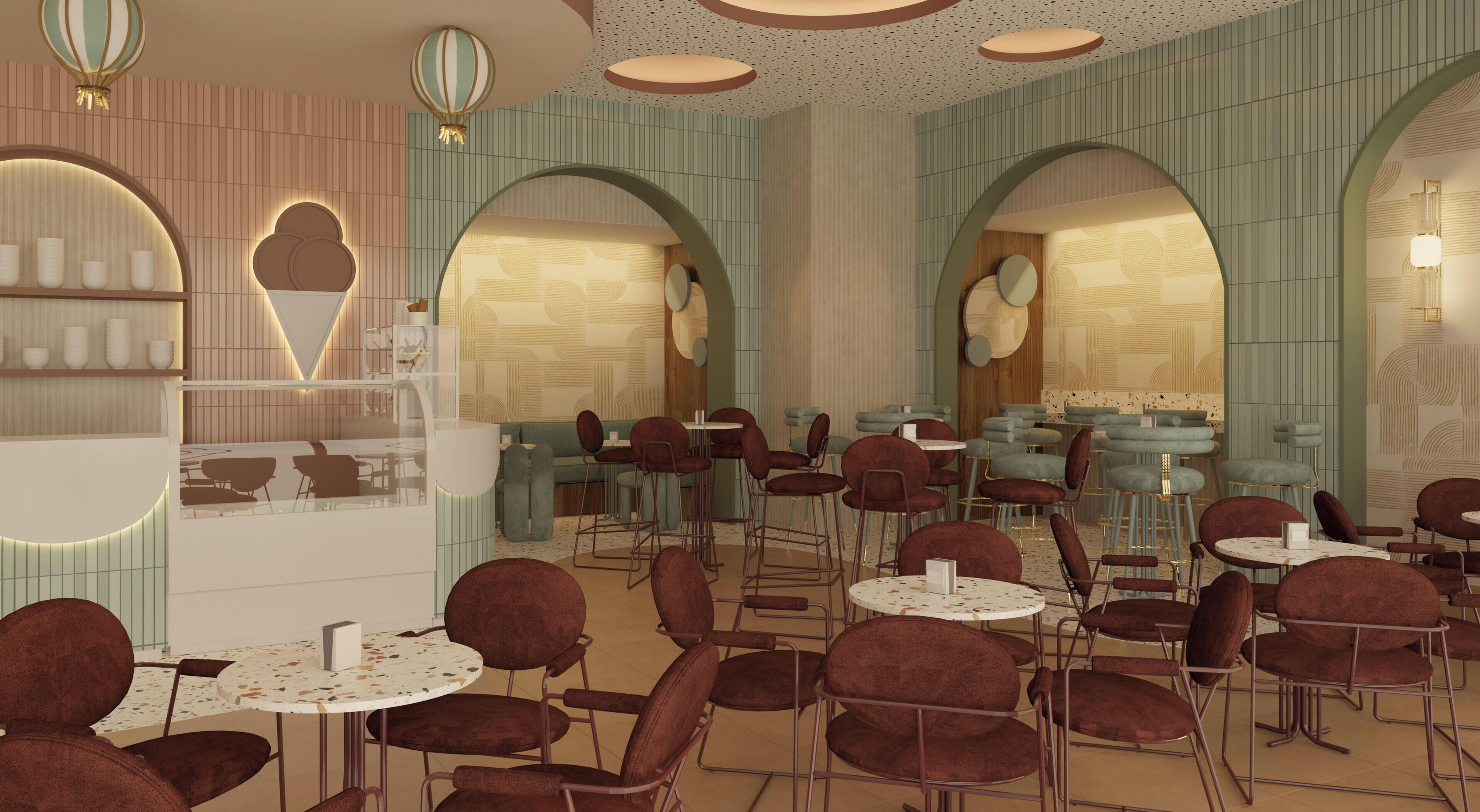 A modern interior with multiple seating areas, including round tables and cushioned chairs, and a warm, inviting atmosphere.