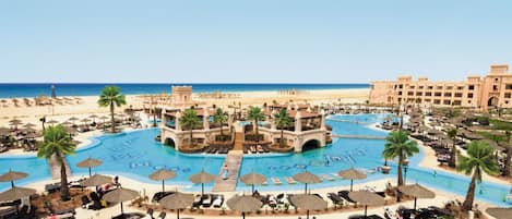 6 outdoor pools, pool umbrellas, sun loungers