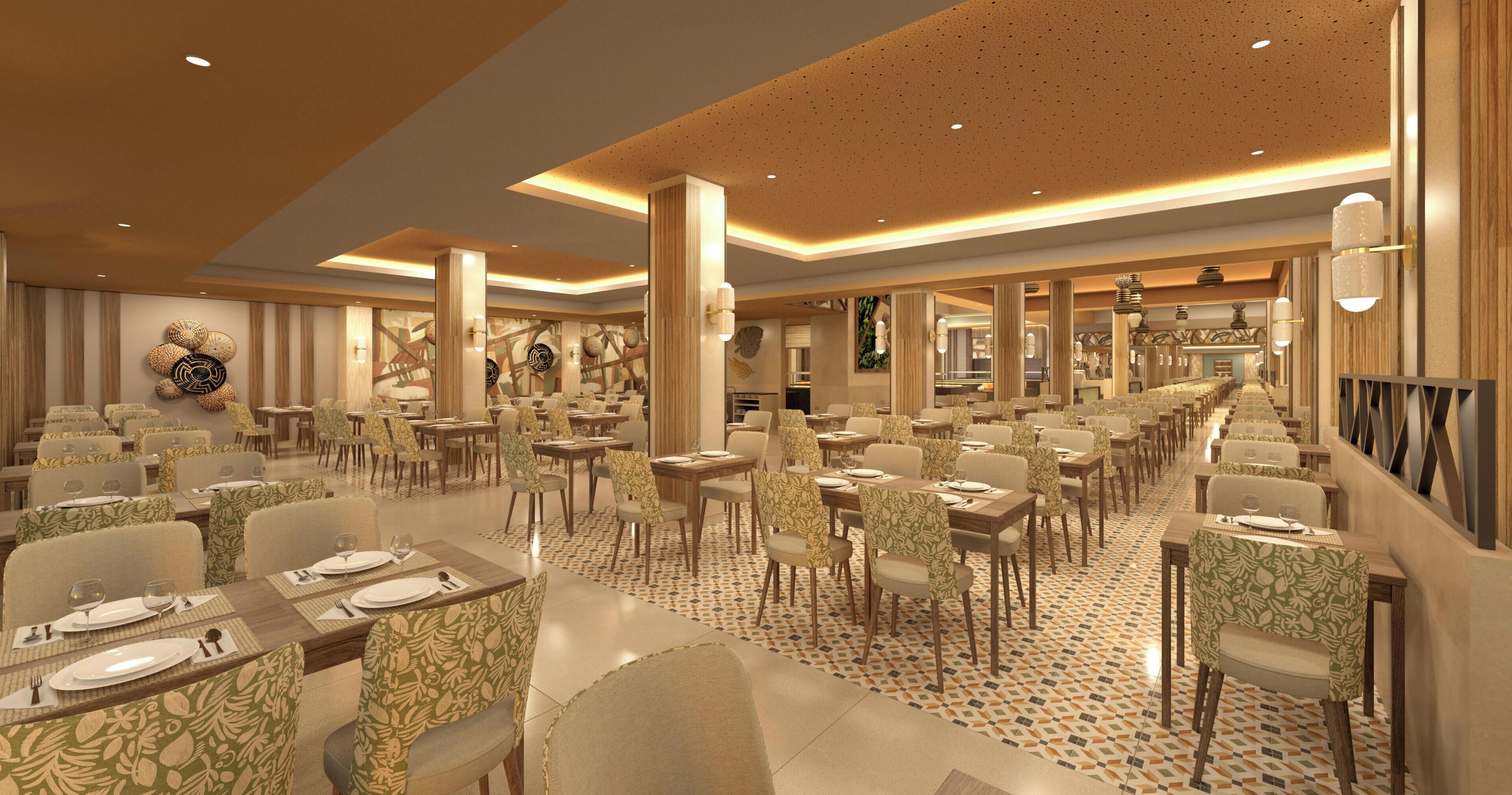 Un restaurant spacieux, doté de nombreuses tables, de chaises et d’un sol à motifs.
