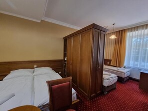 Quadruple Room, Courtyard View | In-room safe, desk, laptop workspace, blackout drapes