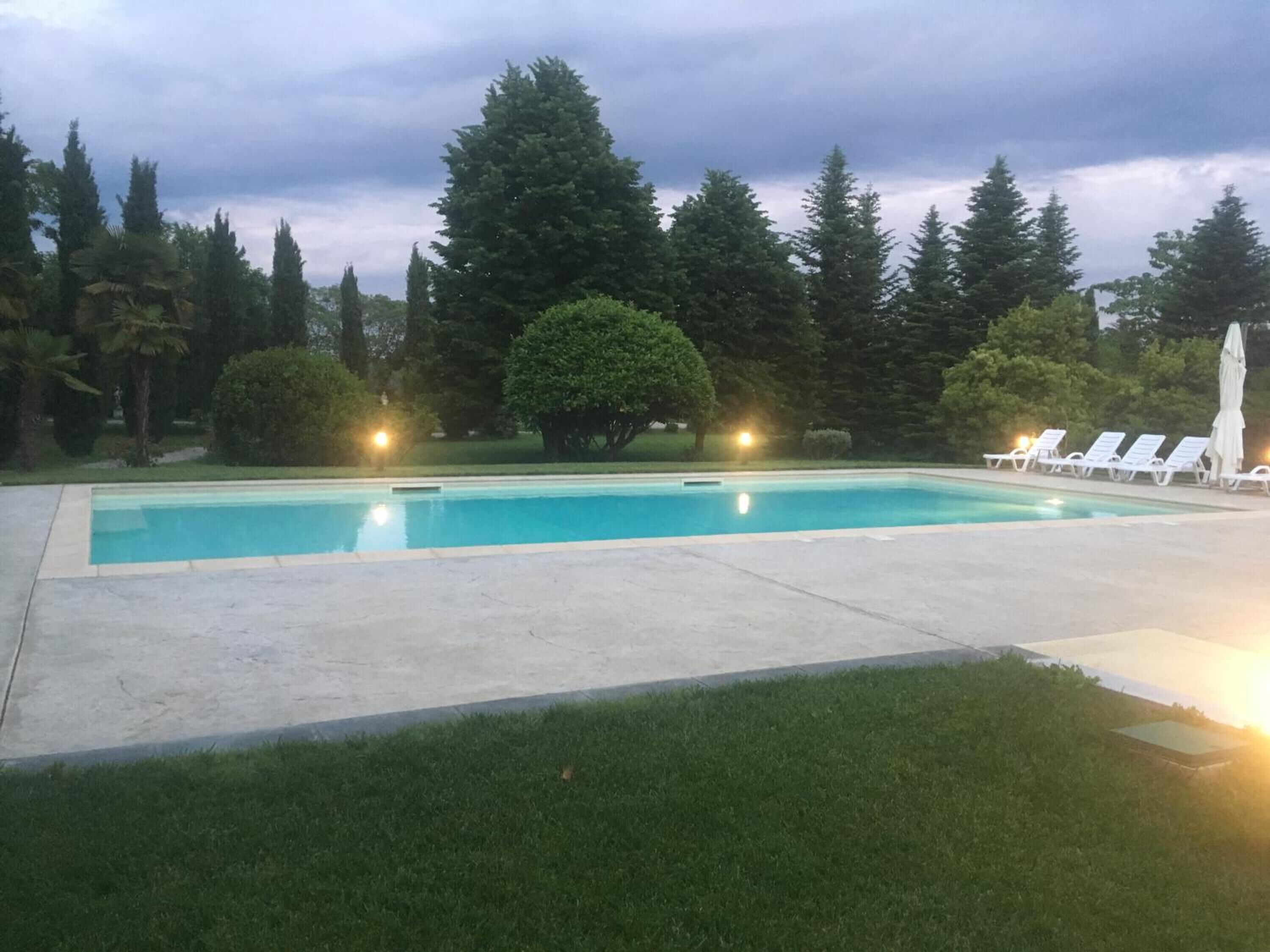 outdoor pool, open 8 am to 7:30 pm, pool loungers