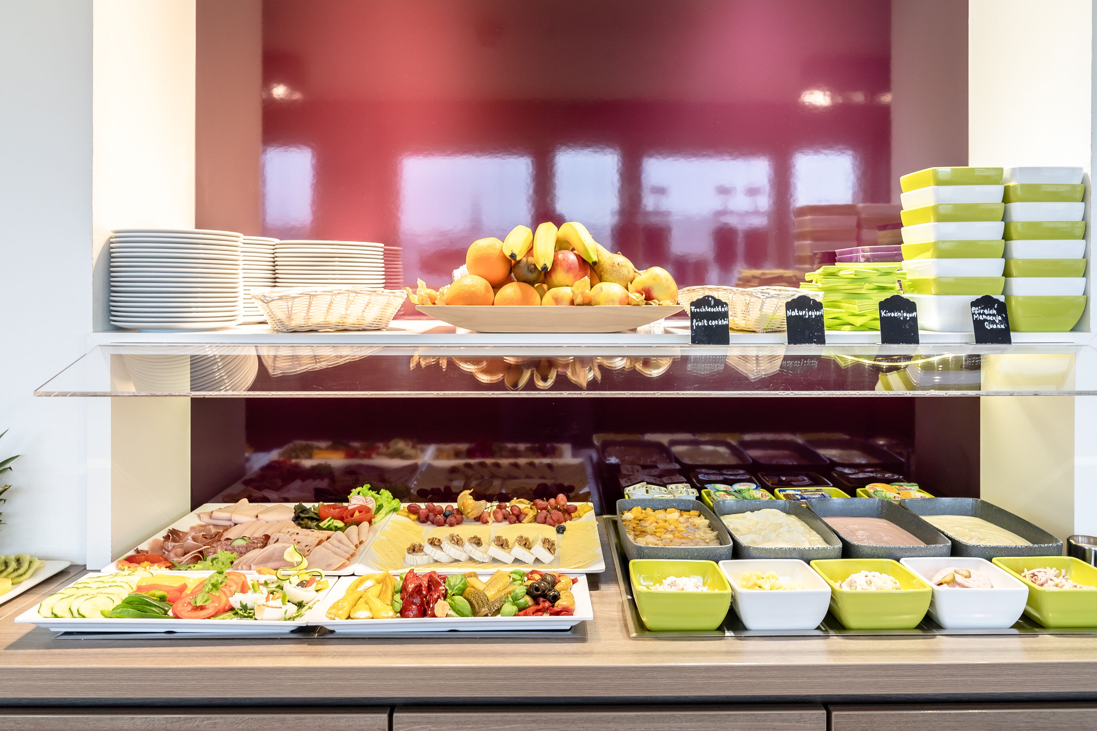 A buffet with various food items and dishes.