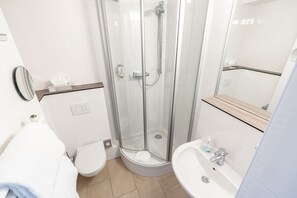 Shower, hair dryer, towels, soap