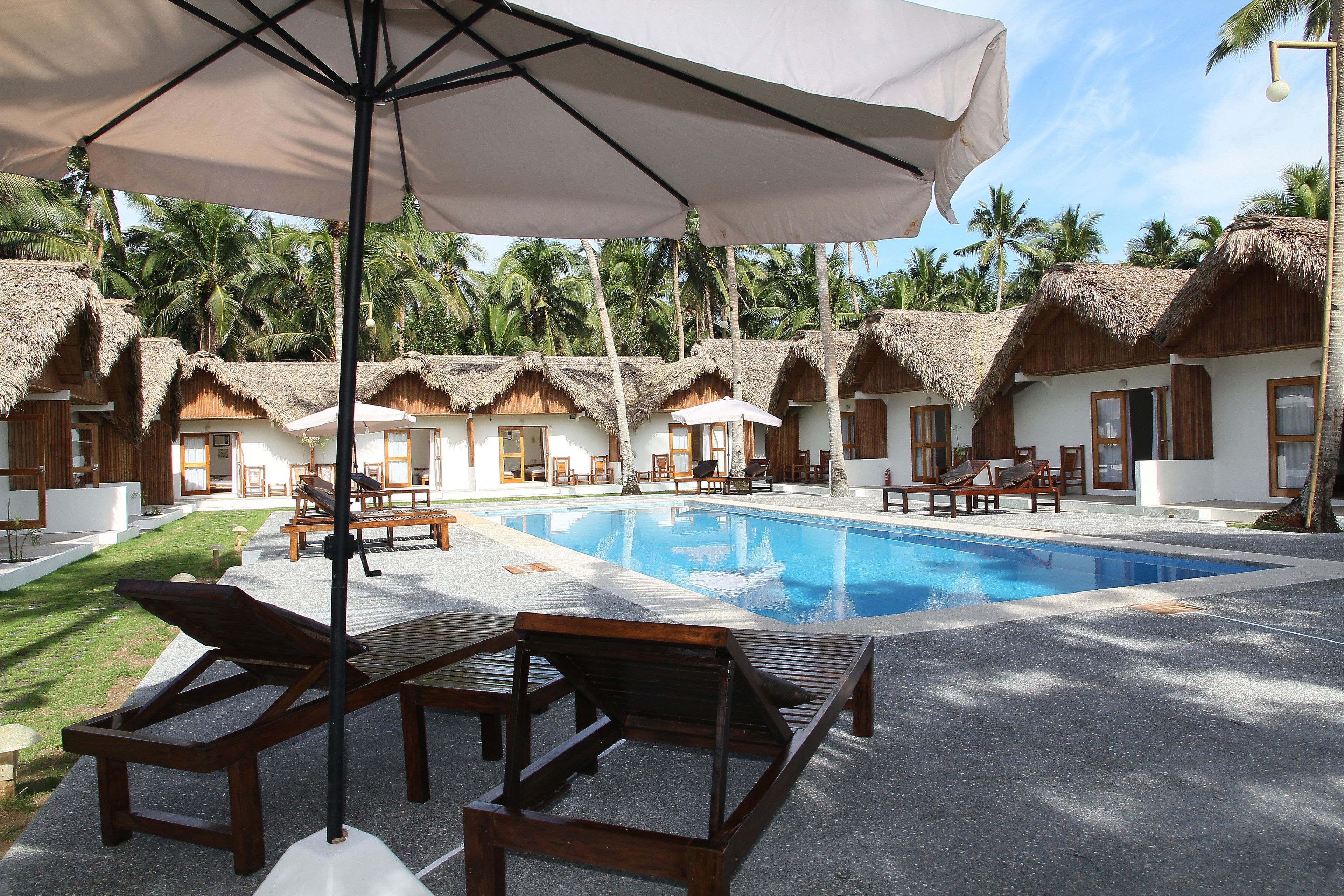 Outdoor pool, open 7:00 AM to 9:00 PM, pool umbrellas