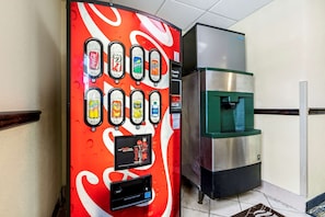 A vending machine with various drink options and a water dispenser. - Comfort Inn Kissimmee-Lake Buena Vista South (Kissimmee)