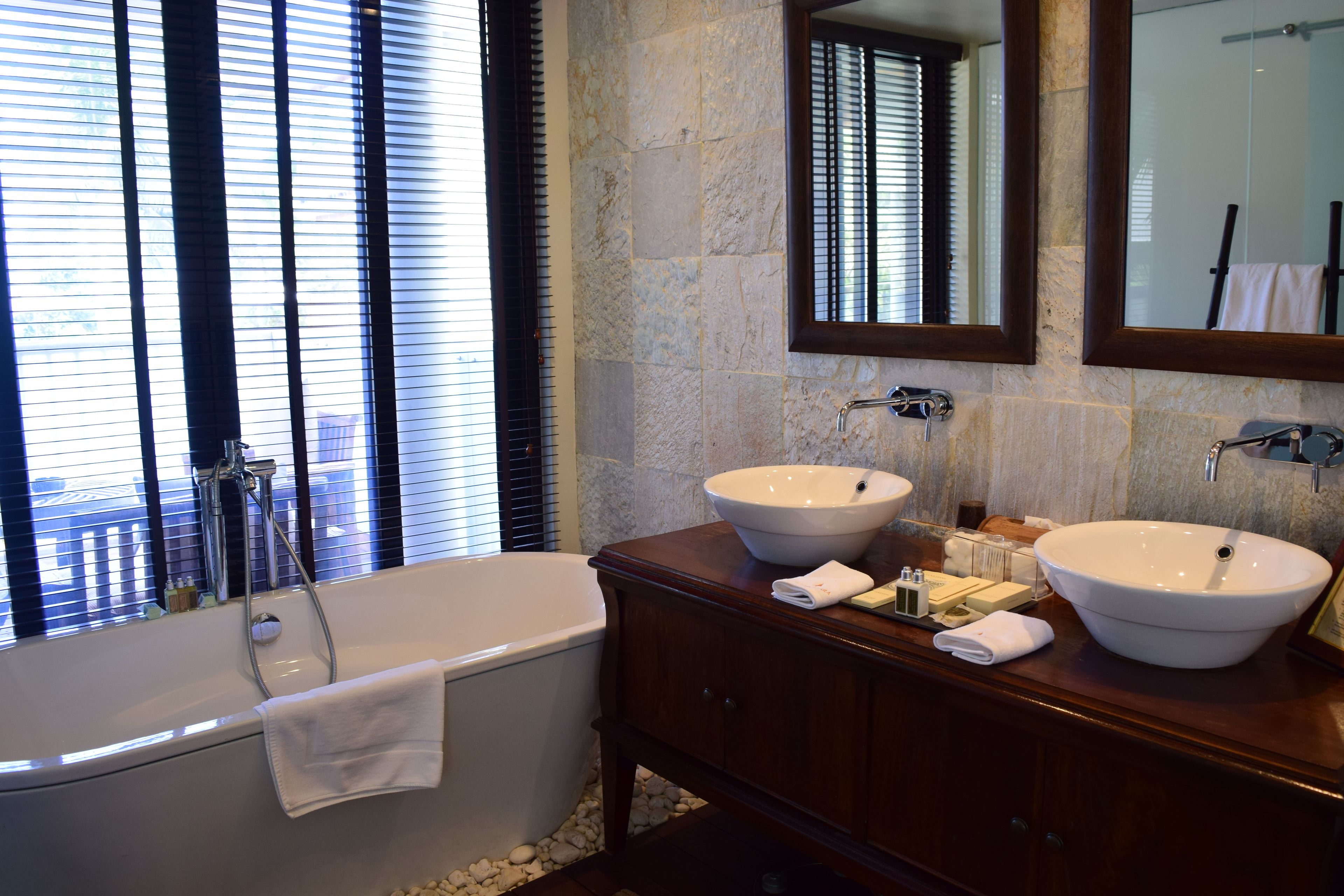 separate bathtub and shower, deep-soaking bathtub, rainfall showerhead