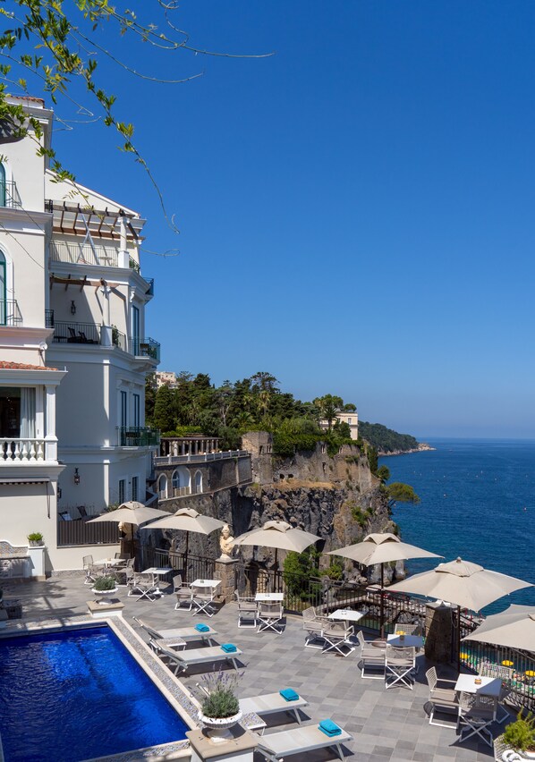 Outdoor pool, pool umbrellas, pool loungers