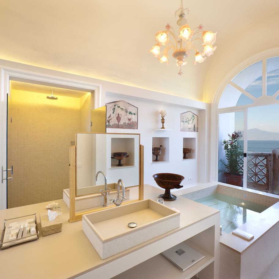 Studio Suite, Hot Tub, Sea View (Pompeiana) | Bathroom | Rainfall showerhead, free toiletries, hair dryer, bathrobes