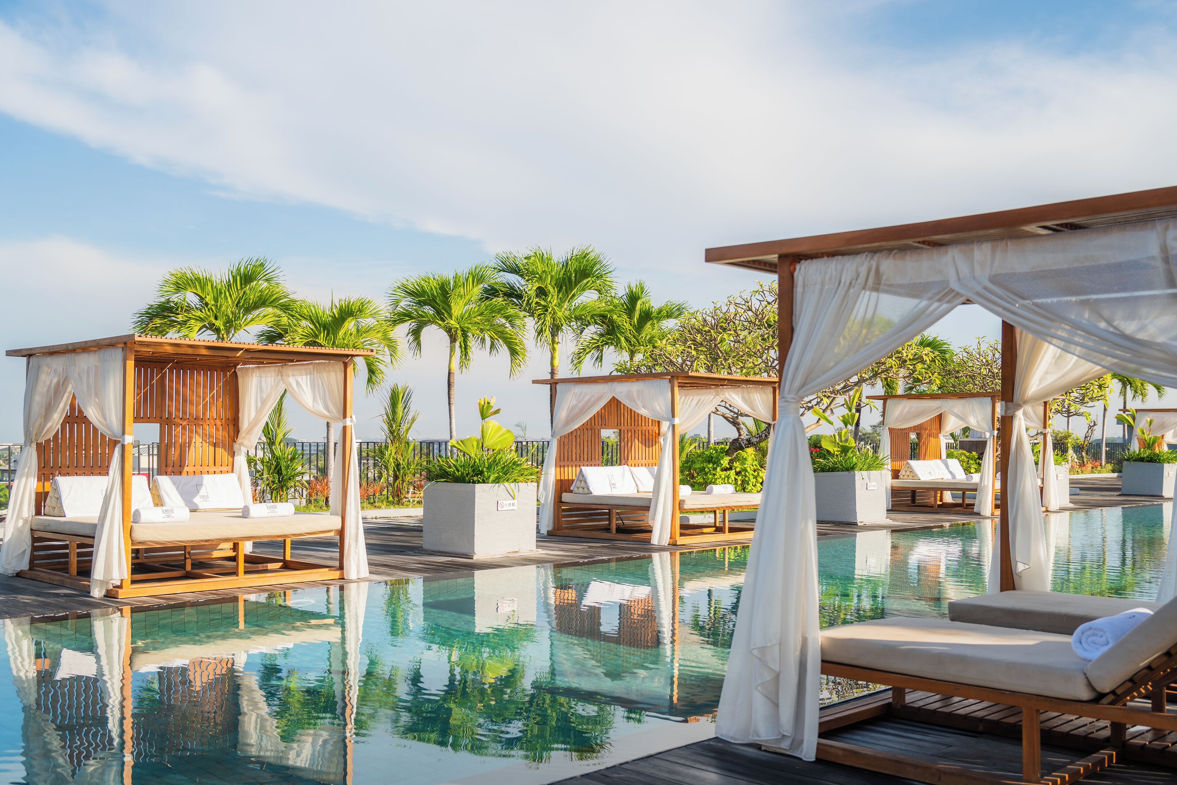 Outdoor pool, open 8:00 AM to 8:00 PM, free cabanas, pool umbrellas