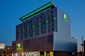 A Holiday Inn hotel with a modern design, featuring a prominent sign and a flat roof. - Holiday Inn Hotel & Suites Saskatoon Downtown by IHG (Saskatoon)