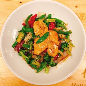 A plate of stir-fried vegetables and shrimp on a white plate. - Holiday Inn Hotel & Suites Saskatoon Downtown by IHG (Saskatoon)
