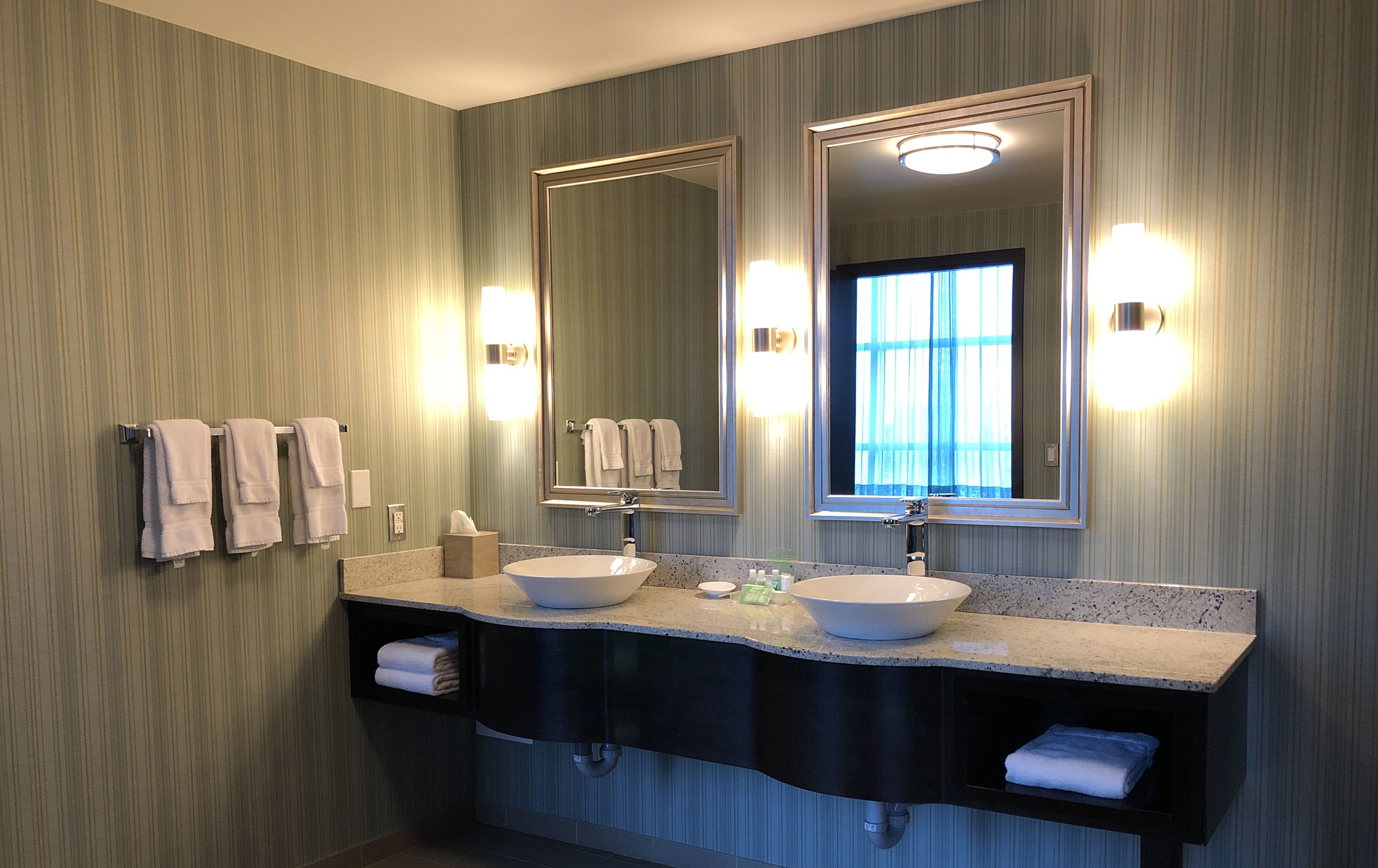 combined shower/bathtub, designer toiletries, hair dryer, towels