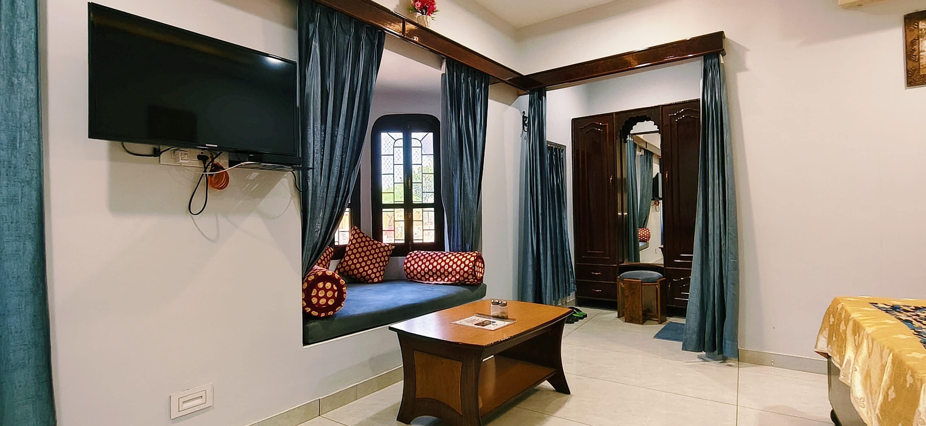 Habitación superior | Zona de estar | Una televisión