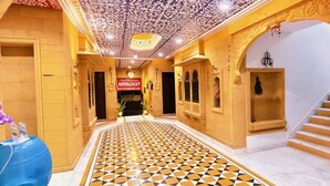 A hotel hallway with patterned flooring, a staircase, and a sign reading "Moonlight." - Hotel Moonlight (Jaisalmer)