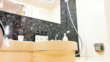 Combined shower/bathtub, free toiletries, hair dryer, bathrobes